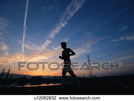 jogging, jogger, exercise, marathon, sky, wire pole, cloud View Large Photo Image Stock Image - jogging, jogger, exercise, marathon, sky, wire pole, cloud. Fotosearch