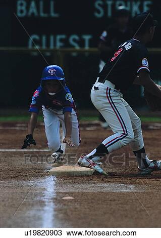 leisure, player, sport, recreation, baseball, sliding base View Large Photo Image Stock Image - leisure, player, sport, recreation, baseball, sliding base. Fotosearch