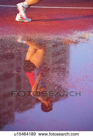 Stock Photo - racer, sport, race, track, sprint, sunset. Fotosearch