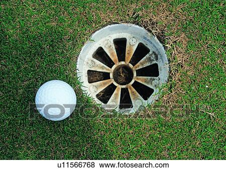 Stock Photo - recreation, sport, grass, exercise, golf, golfball, leisure. Fotosearch