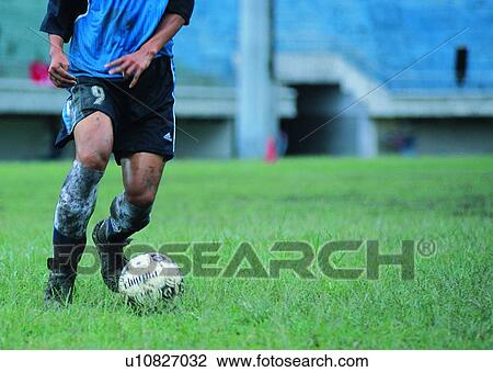 Stock Image - soccer, player, exercise, soccer ball, leisure, football field. Fotosearch