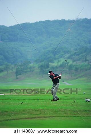Stock Photo - sport, recreation, leisure, exercise, golf, mountain. Fotosearch