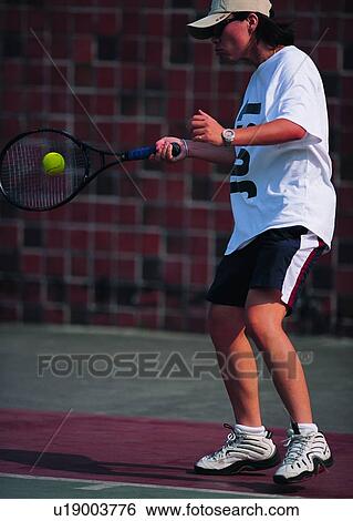 Stock Photograph - sport, recreation, leisure, exercise, tennis, tennis ball. Fotosearch