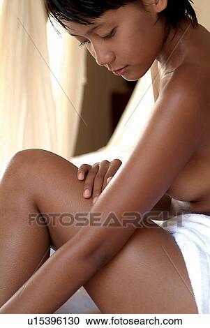 Stock Image - Female, Indoor, Spa at Bali I, Close-Up, One Young Woman Only, Short Hair, Health Spa. Fotosearch