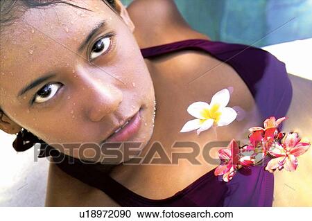 Stock Image - Health Spa, Young Adult, Relaxation, Flower, Water, Glamour. Fotosearch