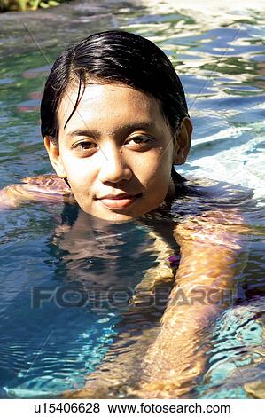Stock Photo - Looking At Camera, Sunlight, Close-Up, Content, Female Beauty, One Person. Fotosearch