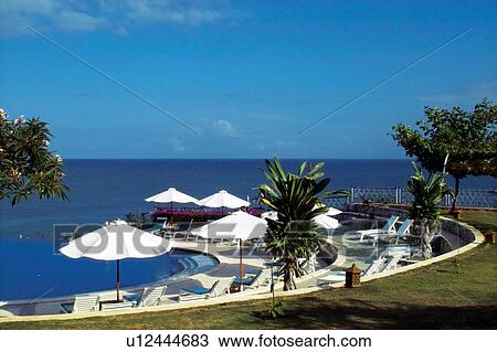 Stock Image - Tourist Resort, Tree, Water, Awe, Blue, Shadow, Bali. Fotosearch