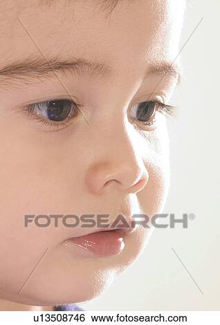 Close-up of a boy's face View Large Photo Image Stock Photograph - Close-up of a boy's face. Fotosearch
