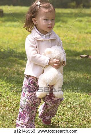 Close-up of a girl hugging a stuffed toy View Large Photo Image Stock Image - Close-up of a girl hugging a stuffed toy. Fotosearch