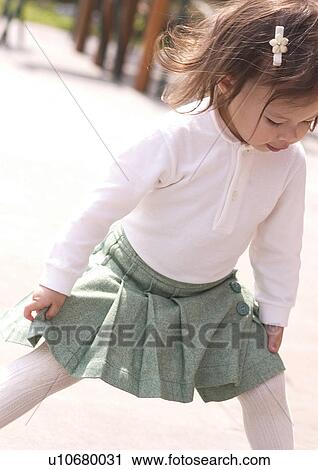Stock Image - Close-up of a girl jumping. Fotosearch