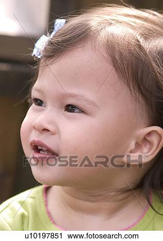 Close-up of a girl looking up View Large Photo Image Stock Image - Close-up of a girl looking up. Fotosearch
