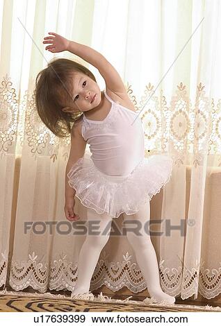 Stock Photo - Close-up of a girl wearing a tutu and posing. Fotosearch