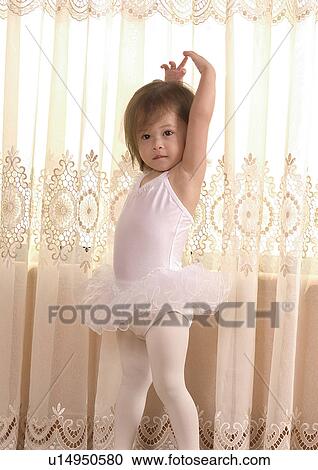 Stock Image - Portrait of a girl in a tutu. Fotosearch