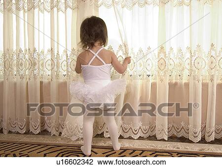 Rear view of a girl wearing a tutu View Large Photo Image Stock Image - Rear view of a girl wearing a tutu. Fotosearch