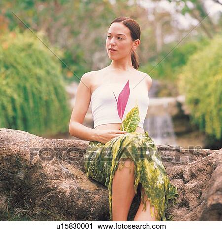 Stock Image - carefree, sitting, square, beauty, looking away. Fotosearch