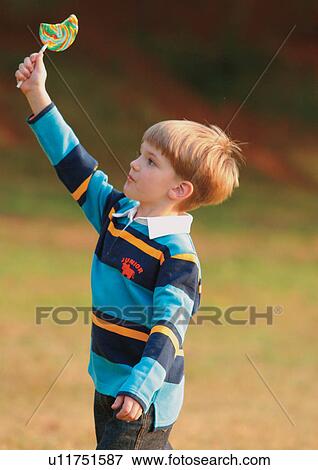 blonde hair, candy, carefree, casual View Large Photo Image Stock Photo - blonde hair, candy, carefree, casual. Fotosearch