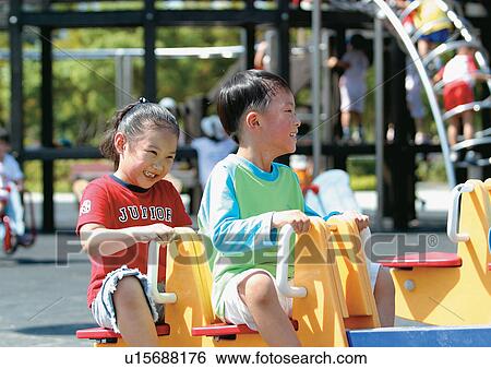 blonde hair, carefree, brother, amusement park View Large Photo Image Stock Photograph - blonde hair, carefree, brother, amusement park. Fotosearch