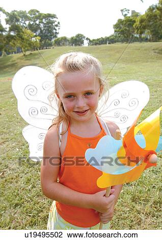 Stock Image - blonde hair, carefree, casual, cheerful. Fotosearch