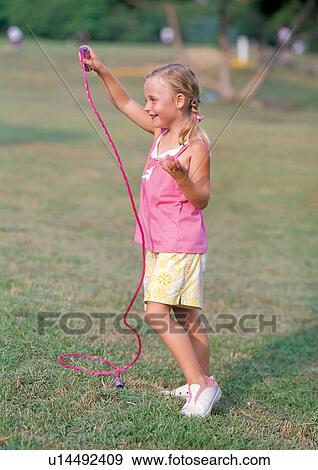 Stock Photo - blonde hair, carefree, casual, cheerful. Fotosearch