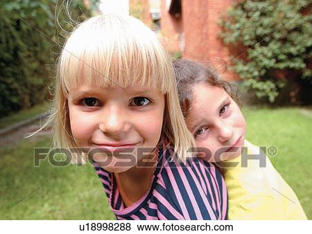 Stock Photo - blonde hair, carefree, casual, cheerful. Fotosearch