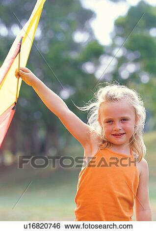 Stock Photograph - blonde hair, carefree, casual, cheerful. Fotosearch