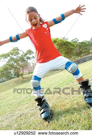Stock Image - blonde hair, casual, carefree, arms outstretched. Fotosearch