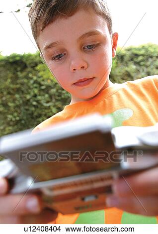 Picture - carefree, boy only, child, game, innocence, cheerful, holding. Fotosearch