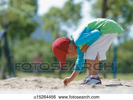 Stock Photograph - carefree, child, casual, happy, shadow, outdoor. Fotosearch
