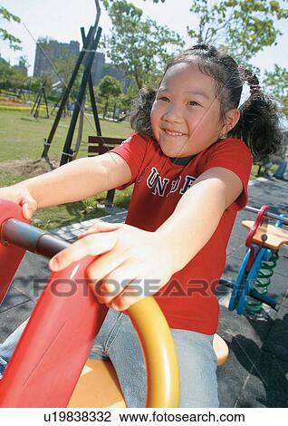 Stock Image - casual, human face, carefree, one girl, cheerful, day. Fotosearch