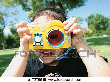 child, clicking, playing, childhood, carefree, grinning, lifestyle View Large Photo Image Stock Photo - child, clicking, playing, childhood, carefree, grinning, lifestyle. Fotosearch