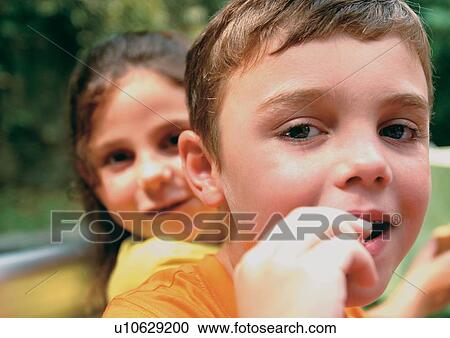Stock Image - childhood, short hair, lifestyle, happy, blonde hair. Fotosearch