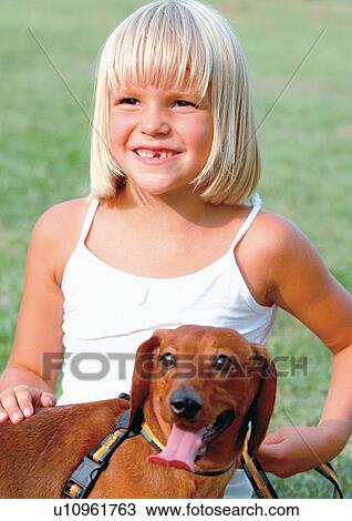 Stock Image - grass, leisure, head and shoulder, park, toothy smile, cheerful, kid. Fotosearch