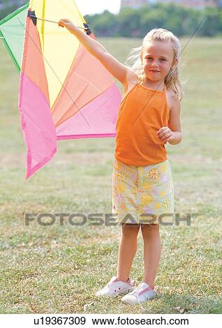 happy, female, portrait, skirt, holding, looking at camera View Large Photo Image Stock Photo - happy, female, portrait, skirt, holding, looking at camera. Fotosearch