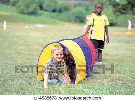 happy, lifestyle, male, grass, day, blonde hair, leisure View Large Photo Image Stock Photo - happy, lifestyle, male, grass, day, blonde hair, leisure. Fotosearch