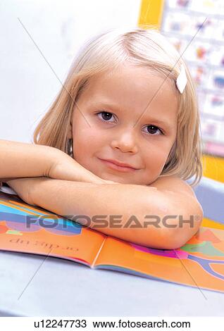 Stock Image - book, leisure, happiness, innocence, child, carefree, lifestyle. Fotosearch
