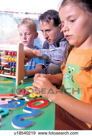 boy, t-shirt, game, standing, childhood View Large Photo Image Stock Photo - boy, t-shirt, game, standing, childhood. Fotosearch