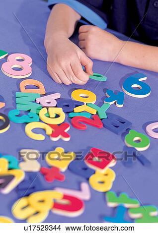 Picture - children's wear, holding, youth, young, indoor. Fotosearch