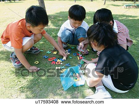 Stock Photo - female, game, outdoor, four people. Fotosearch
