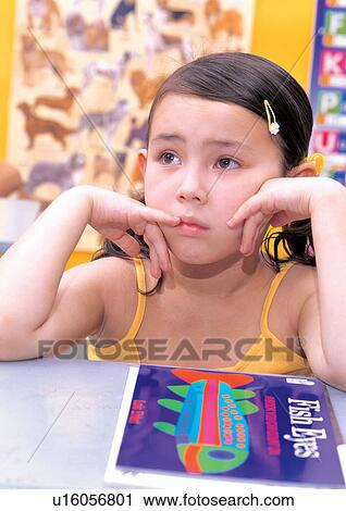 Stock Image - female, kid, looking away, blonde hair, innocence, sad. Fotosearch