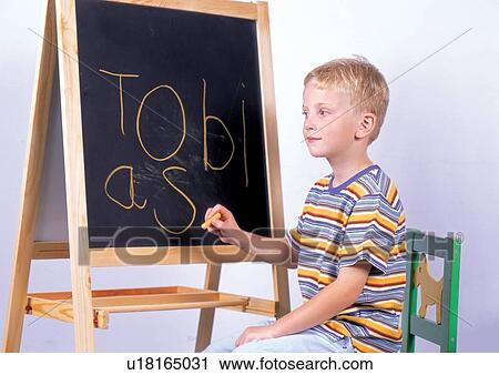 Stock Image - grinning, sitting, human hand, casual, children's wear. Fotosearch