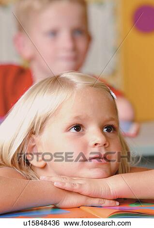 grinning, sitting, smirking, casual, children's wear View Large Photo Image Stock Photograph - grinning, sitting, smirking, casual, children's wear. Fotosearch