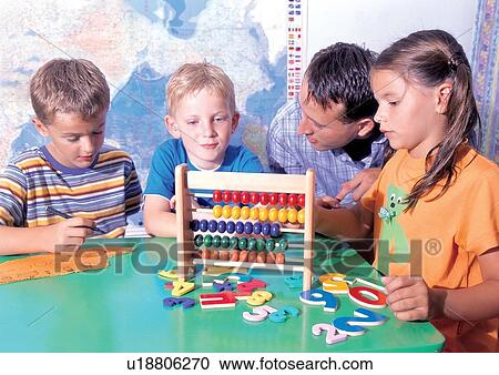 Stock Image - grinning, sitting, standing, casual, children's wear. Fotosearch