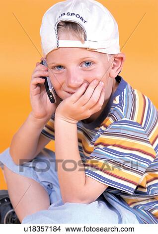 Picture - grinning, smiling, human face, casual, children's wear. Fotosearch