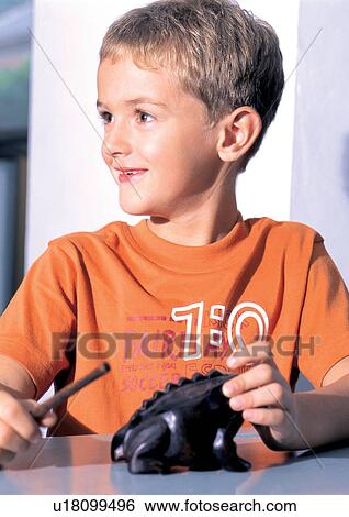 Stock Photograph - grinning, smiling, human face, casual, children's wear. Fotosearch