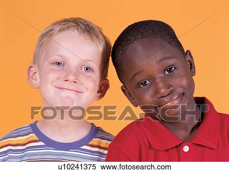 Stock Photography - grinning, smiling, side by side, human face, casual. Fotosearch