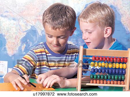 Stock Image - grinning, standing, casual, children's wear, short sleeved. Fotosearch