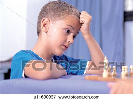 Stock Photo - hand on head, close-up, one person, t-shirt, table, male. Fotosearch