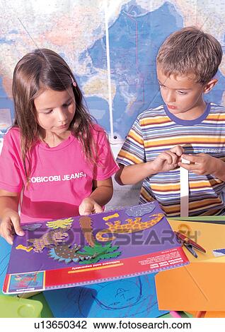 holding, standing, side by side, casual, children's wear View Large Photo Image Stock Image - holding, standing, side by side, casual, children's wear. Fotosearch