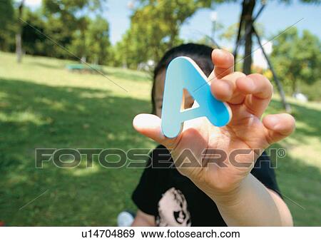 Stock Photo - outdoor, short sleeved, human hands, game, child, fun. Fotosearch