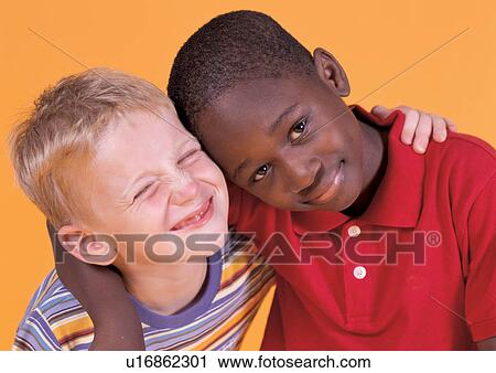 Stock Image - smiling, friend, casual, portrait, side by side, close-up. Fotosearch